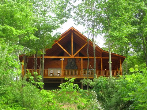 two story cabin in woods