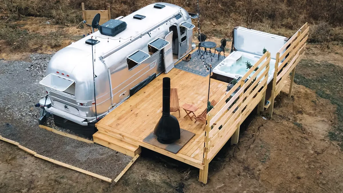 Vintage Airstream on hilltop with view