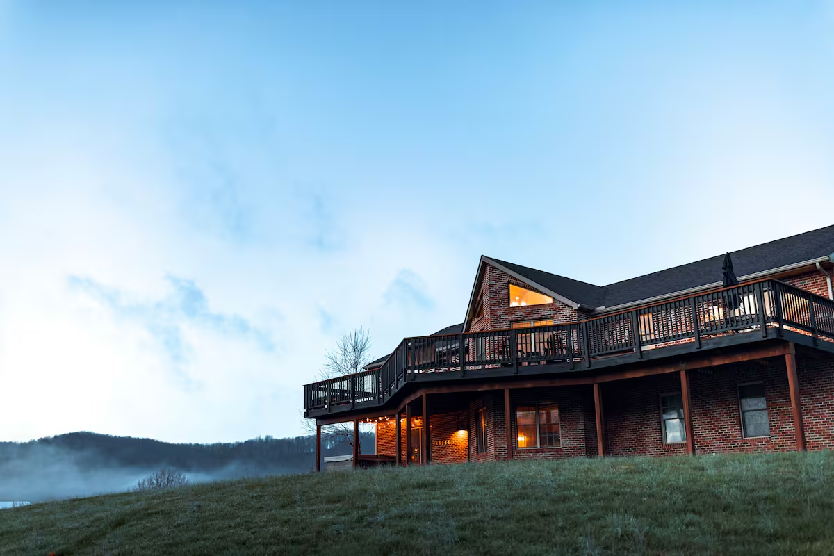 Front exterior of Whiskey Ridge Lodge with wraparound deck